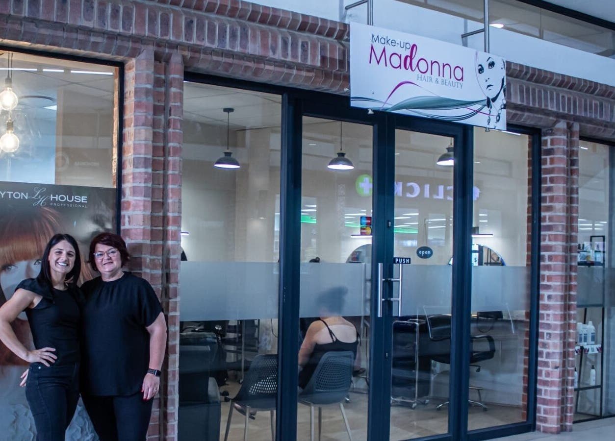 Ilze at Makeup Madonna's elegant entrance in Wellington, Western Cape, ZA with staff welcoming visitors.