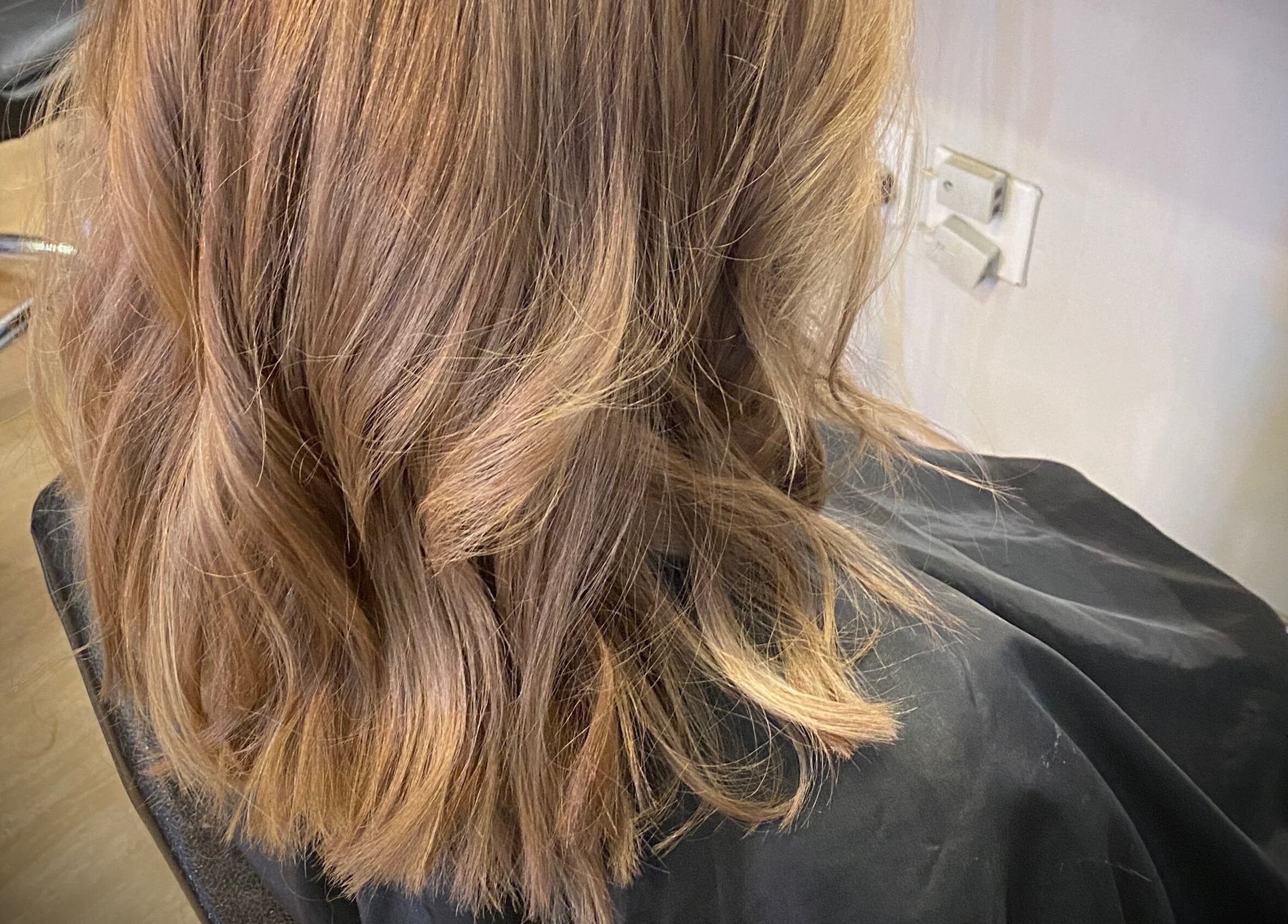 Styled brown wavy hair at Ilze at Makeup Madonna, Wellington, Western Cape, ZA salon.