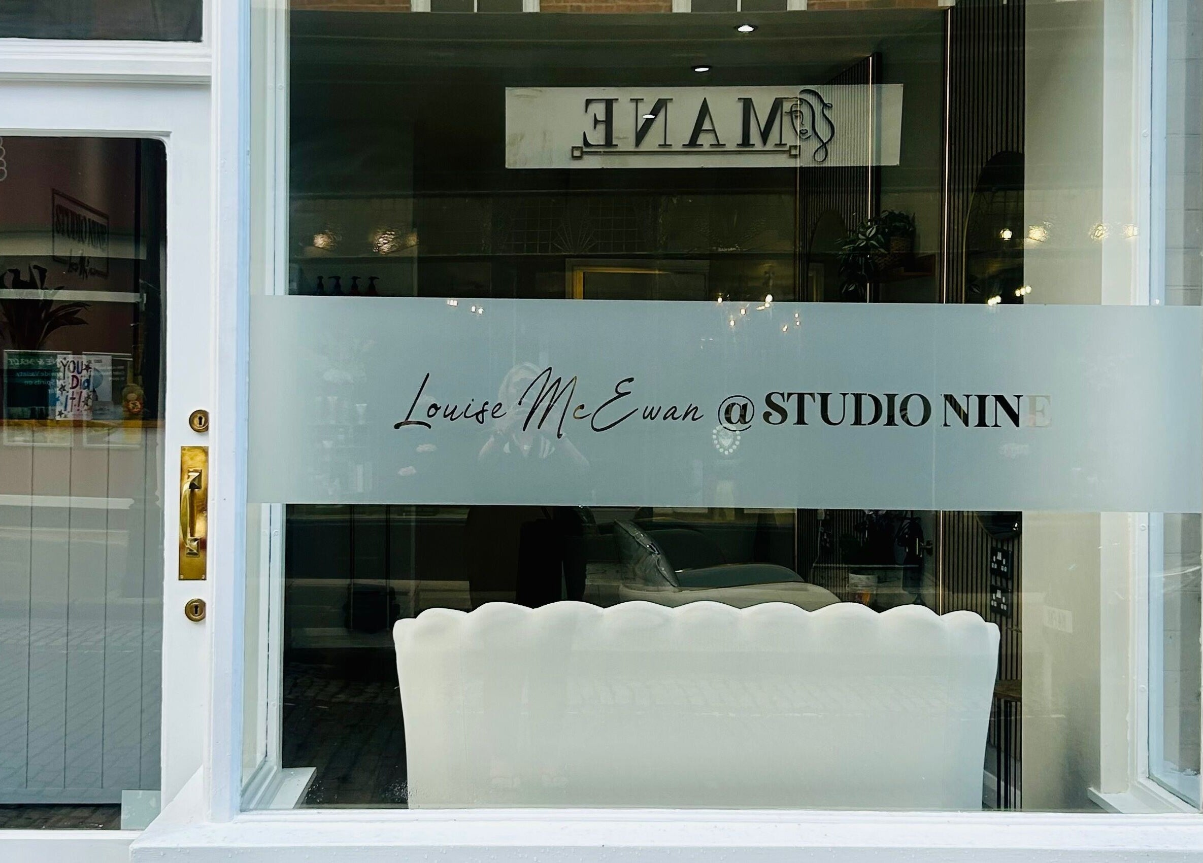 Exterior of Studio Nine with Louise McEwan in Newport, England, showing stylish window signage.