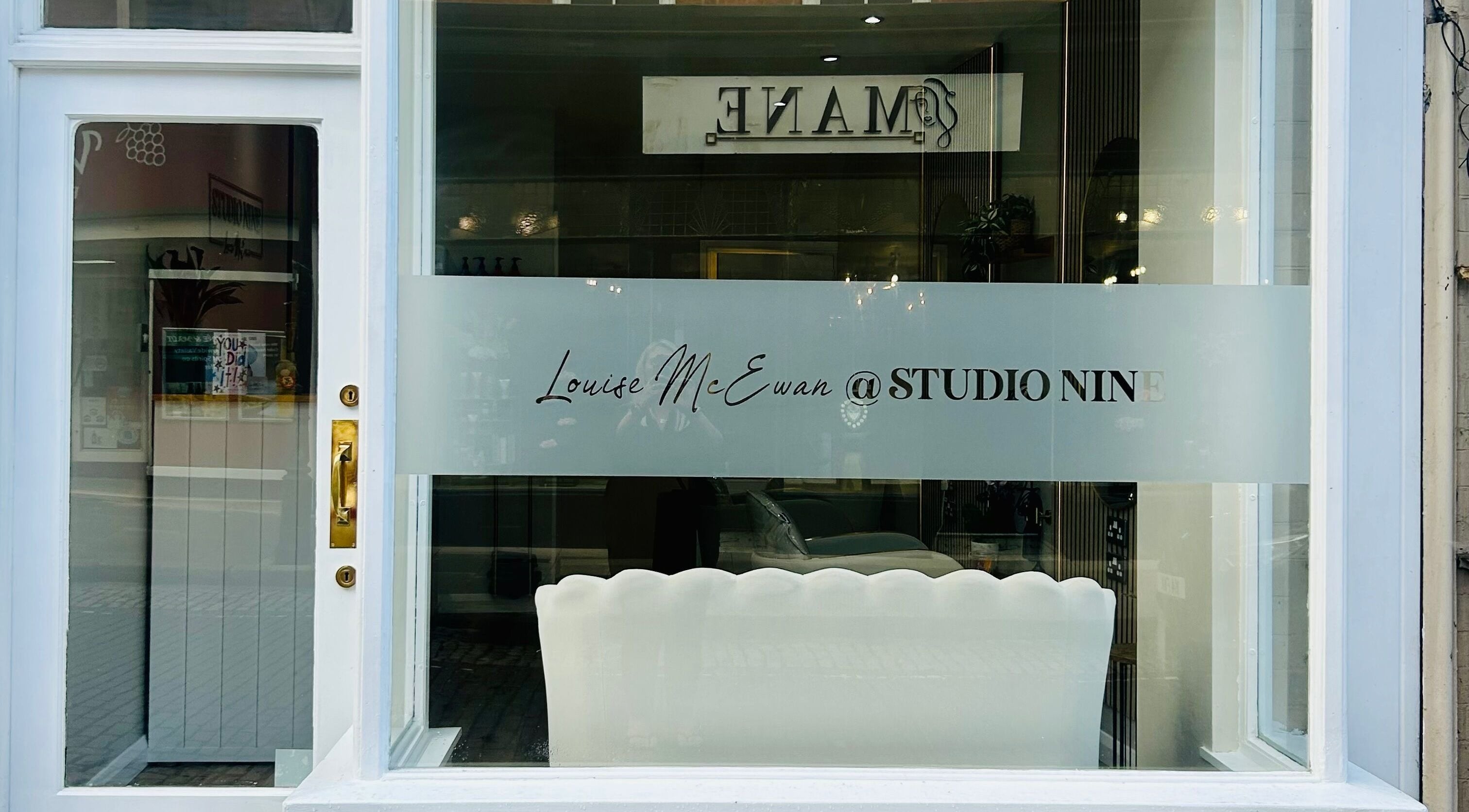 Exterior of Studio Nine with Louise McEwan in Newport, England, showing stylish window signage.