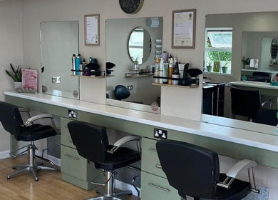 Modern styling stations at Polgooth Village Salon in Polgooth, England, GB showcasing sleek design and equipment.