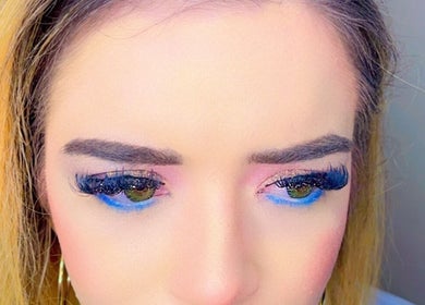 Close-up of dramatic eye makeup with blue accents at Ruby’s Beauty Room, Birmingham, England, GB.
