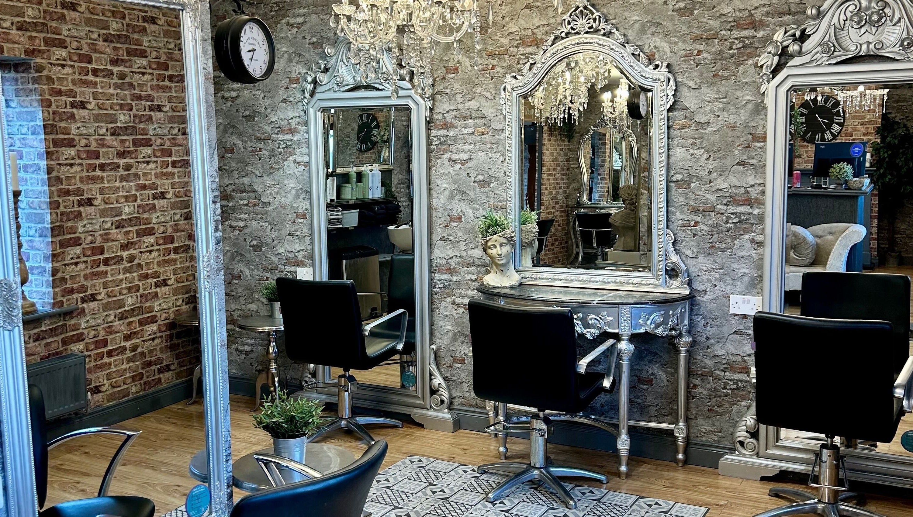Chic and stylish salon interior at Hair Factory, Prosperous, County Kildare, IE with vintage mirrors and chairs.