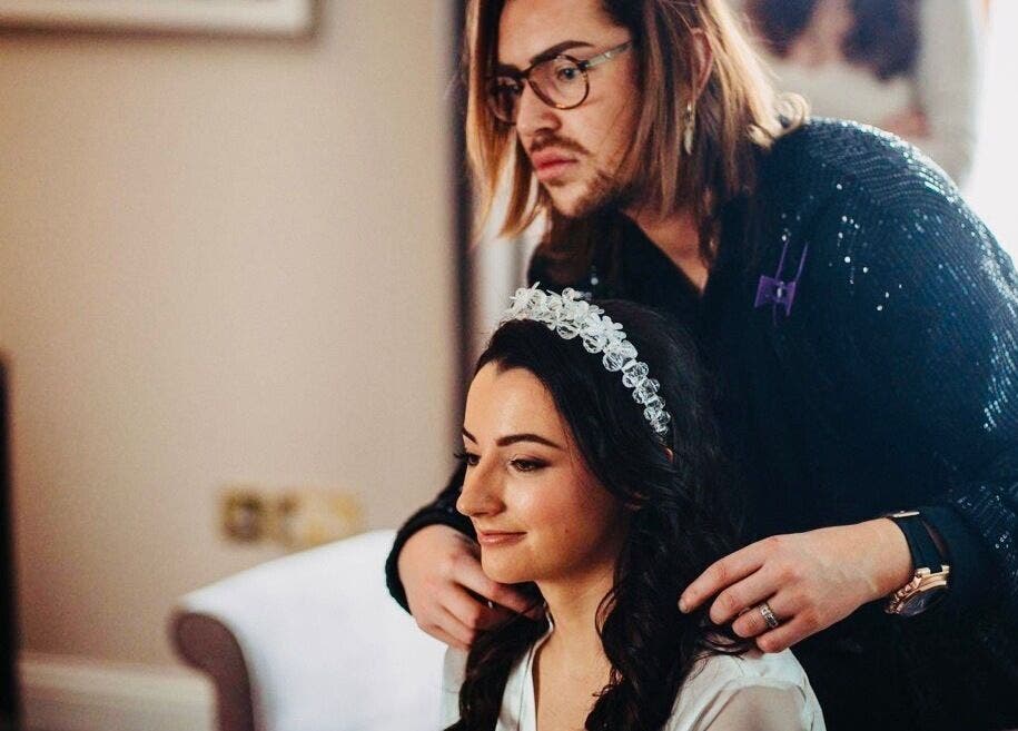 Hairdresser styling a woman's hair at Hair Factory, Prosperous, County Kildare, IE.