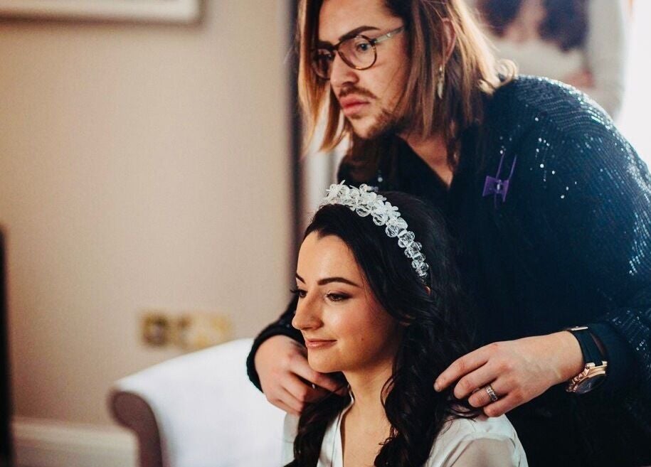 Hairdresser styling a woman's hair at Hair Factory, Prosperous, County Kildare, IE.