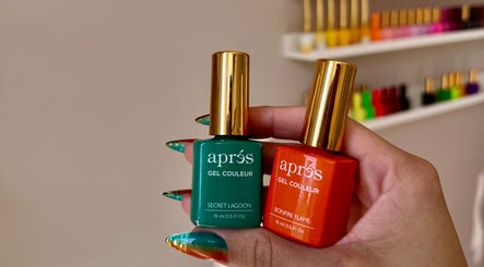 Two vibrant nail polish bottles at POSHROOM in Sabana Seca, Toa Baja, PR, showcasing vivid hues.