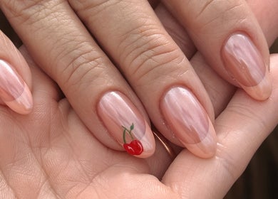 Elegant nails with cherry design at POSHROOM, Sabana Seca, Toa Baja, PR, showcasing professional nail art.
