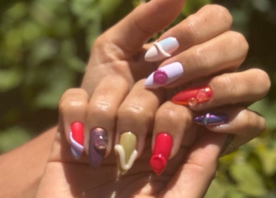 Colorful nail art at POSHROOM in Sabana Seca, Toa Baja, PR, showcasing diverse designs and vibrant hues.