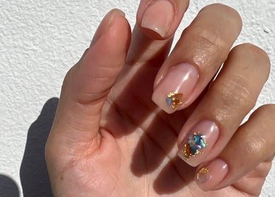 Elegant nail art at POSHROOM, Sabana Seca, Toa Baja, PR, featuring delicate gems and subtle shine.