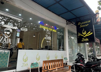 Front view of Zain Barber Legian Kuta, a trendy barber shop in Bali, Bali, ID with vibrant signage and inviting decor.