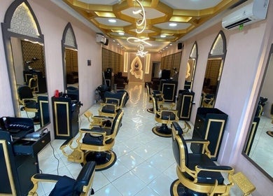 Luxurious interior of Zain Barber Canggu in Bali, Bali, ID, featuring elegant gold-accented barber chairs.