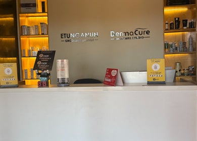 Reception area of Dermacure Skincare Studio in Kira Town, Central Region, UG with products on display.