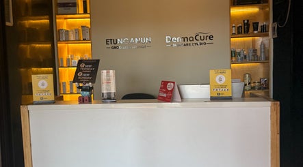 Reception area of Dermacure Skincare Studio in Kira Town, Central Region, UG with products on display.