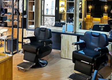 Modern interior of Etunganun Grooming and Beauty Lounge, Kira Town, Central Region, UG with sleek chairs and mirrors.