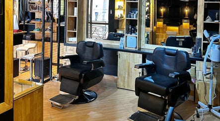 Modern interior of Etunganun Grooming and Beauty Lounge, Kira Town, Central Region, UG with sleek chairs and mirrors.