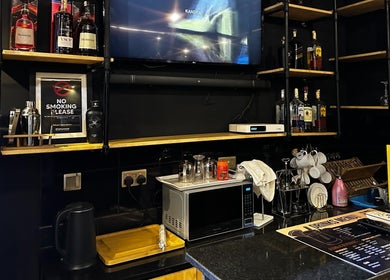 Chic bar area at Etunganun Grooming and Beauty Lounge, Kira Town, Central Region, UG with sleek shelves and decor.