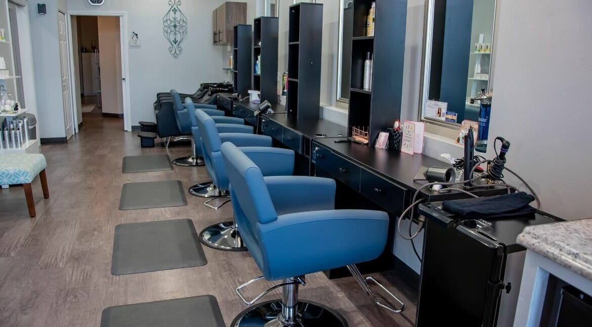 Modern styling stations at Vazul Hair Artistry in Ocala, Florida, US provide a chic and inviting atmosphere.