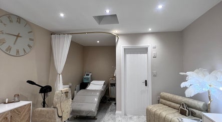 Tranquil treatment room at Imperfection Beauty, London, England, GB, with modern decor and spa bed.