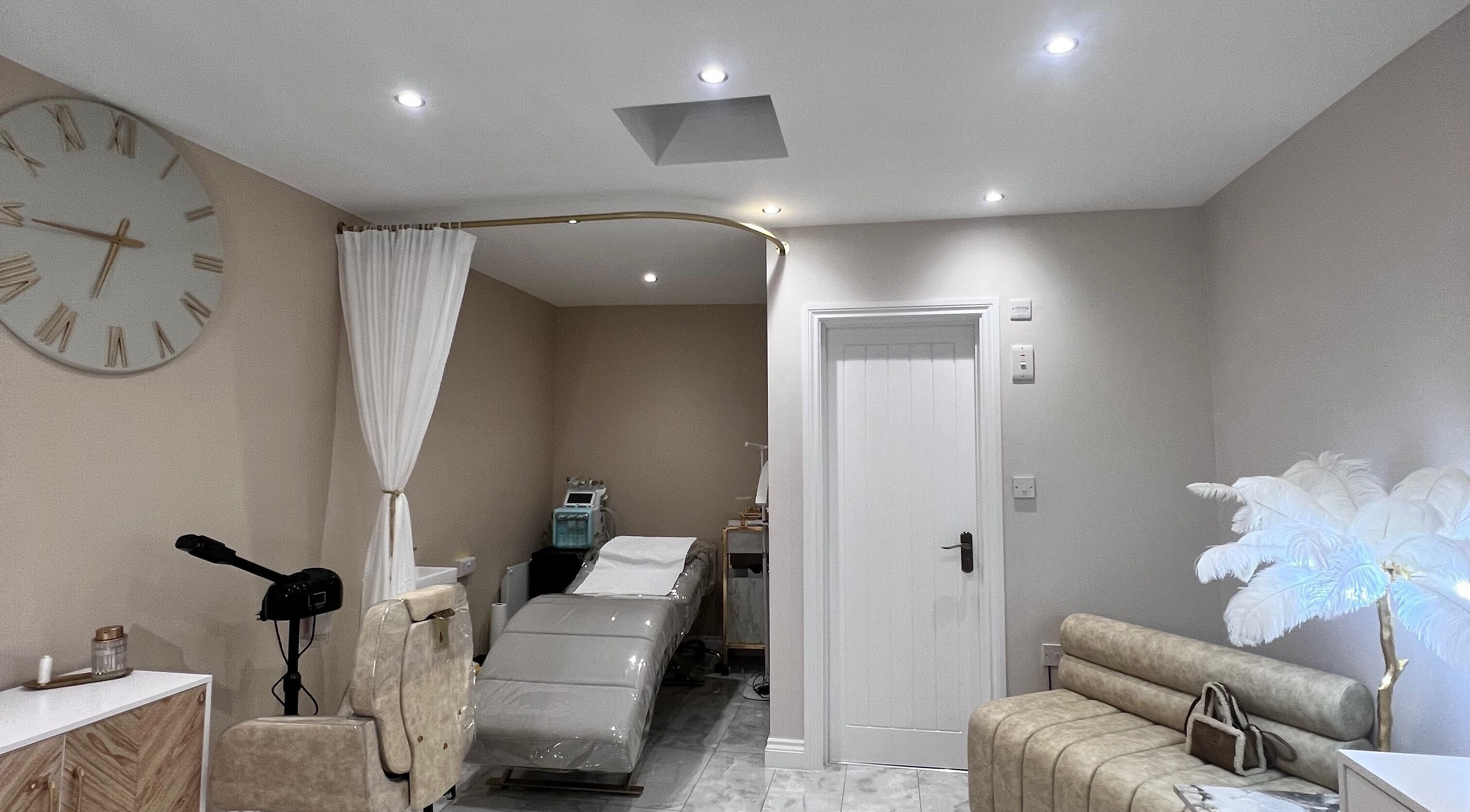 Tranquil treatment room at Imperfection Beauty, London, England, GB, with modern decor and spa bed.