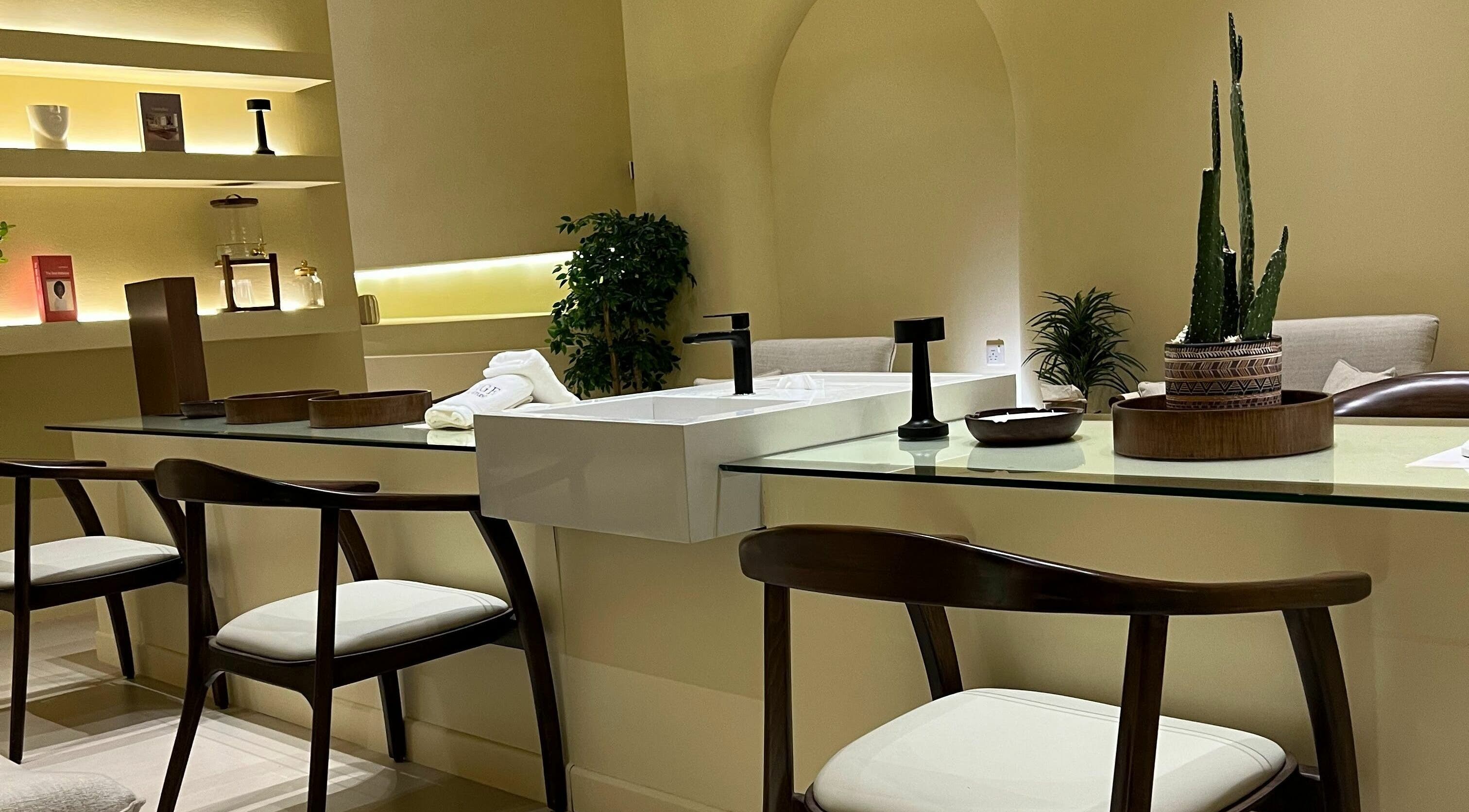 Elegant interior of Beige Nail Studio in Riyadh, SA showcasing modern nail care stations and serene decor.