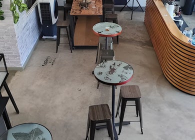 Interior of Sally Mustang Tattoo Joburg with artistic decor and seating in Johannesburg, Gauteng, ZA.