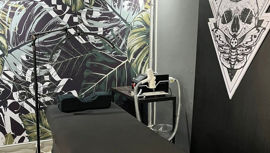Tattoo station at Sally Mustang Tattoos Cape Town with artistic decor in Cape Town, Western Cape, ZA.