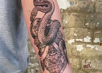 Intricate snake tattoo at Sally Mustang Tattoos Cape Town, located in Cape Town, Western Cape, ZA.