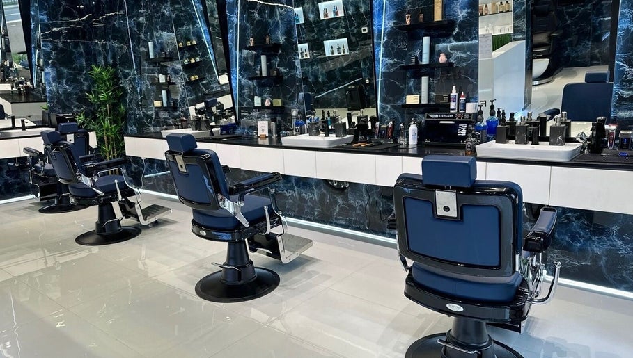 Sleek interior of Fresh Fades Mens Barbershop in Dubai, Dubai, AE, featuring modern barber chairs and polished decor.