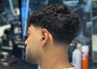 Close-up of a sleek haircut at Fresh Fades Mens Barbershop, Dubai, Dubai, AE showcasing expert barber skills.
