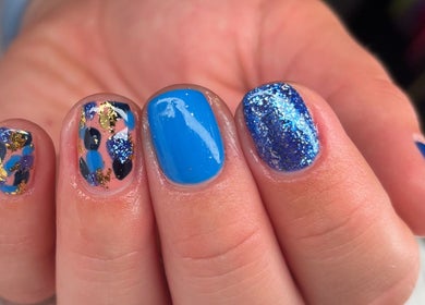 Stylish blue glitter nails at Jessica Bentley Beauty in Brough, England, GB.