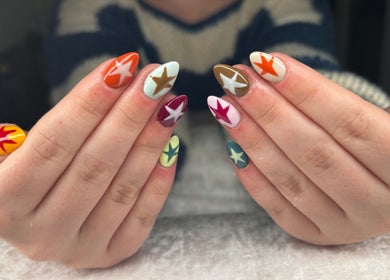 Colorful star nail art at Jessica Bentley Beauty, Brough, England, showcasing vibrant creativity and style.