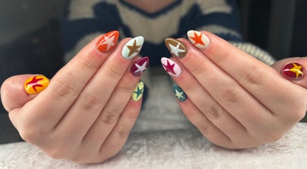 Colorful star nail art at Jessica Bentley Beauty, Brough, England, showcasing vibrant creativity and style.
