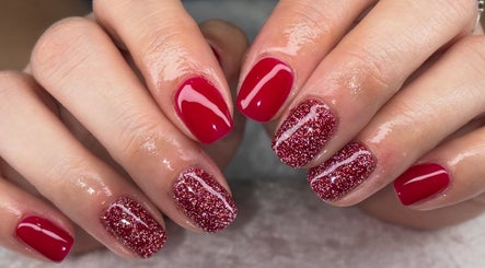 Sparkling red manicure at Jessica Bentley Beauty, Brough, England, GB. Perfect polish and shimmer blend.