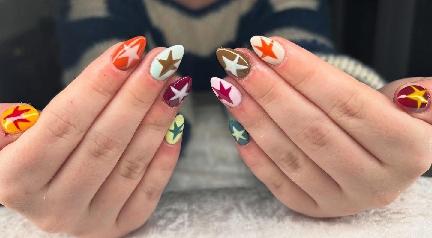 Colorful star-designed nails showcased at Jessica Bentley Beauty, Brough, England, GB.