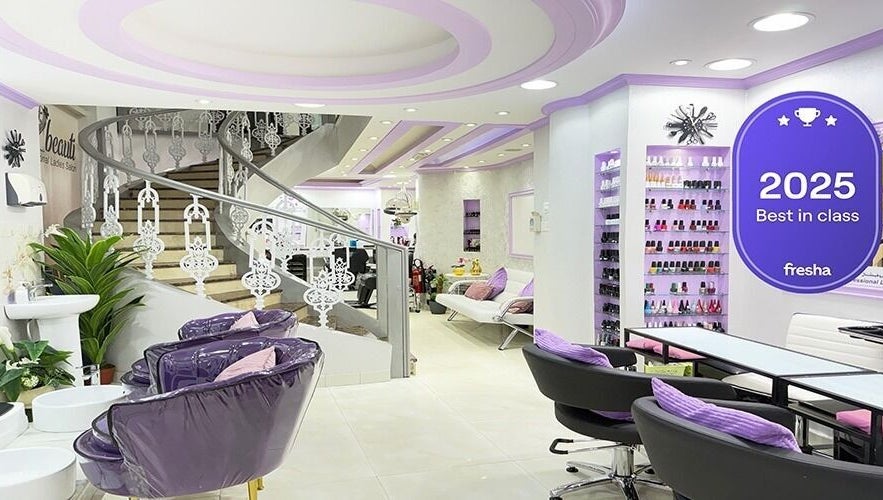 Elegant interior of SAbeauti Professional Ladies Salon in Dubai, AE with purple accents and stylish décor.
