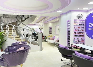 Elegant interior of SAbeauti Professional Ladies Salon in Dubai, AE with purple accents and stylish décor.