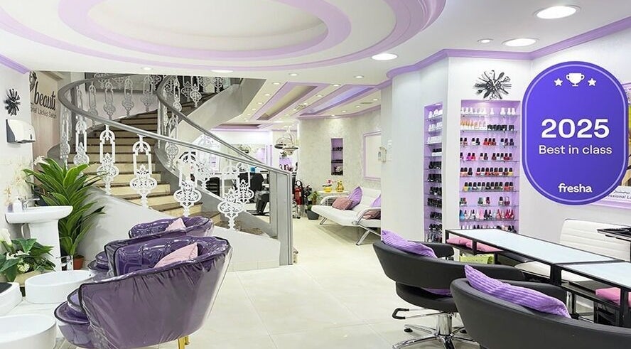 Elegant interior of SAbeauti Professional Ladies Salon in Dubai, AE with purple accents and stylish décor.