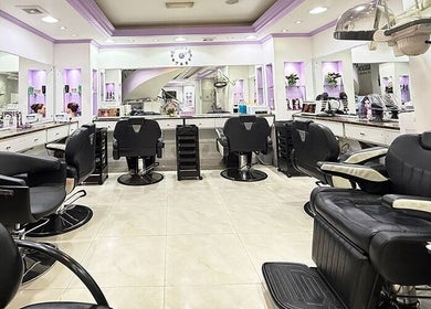 Interior of SAbeauti Professional Ladies Salon, Dubai, AE; modern chairs and styling stations.