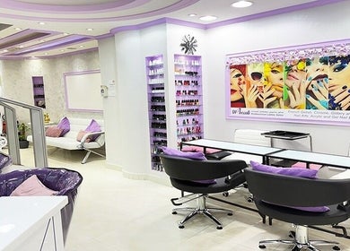 Modern interior of SAbeauti Professional Ladies Salon in Dubai, AE featuring chic lavender decor and nail services.