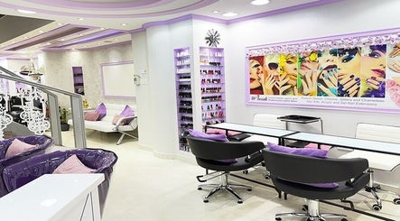 Modern interior of SAbeauti Professional Ladies Salon in Dubai, AE featuring chic lavender decor and nail services.