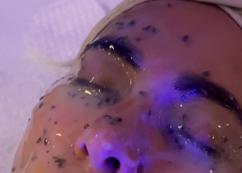 Client receiving rejuvenating facial treatment at Filtrdxrosy in Boston, Massachusetts, US.