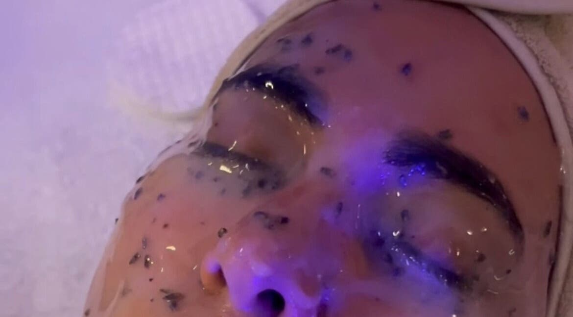 Client receiving rejuvenating facial treatment at Filtrdxrosy in Boston, Massachusetts, US.