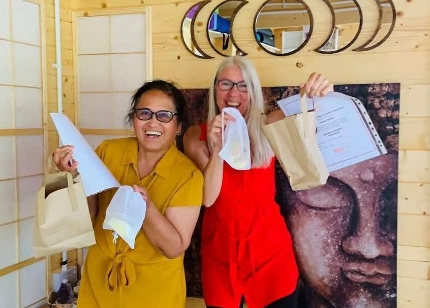 Two women celebrating with certificates at Southampton SO19 9JR venue, Southampton, England, GB.