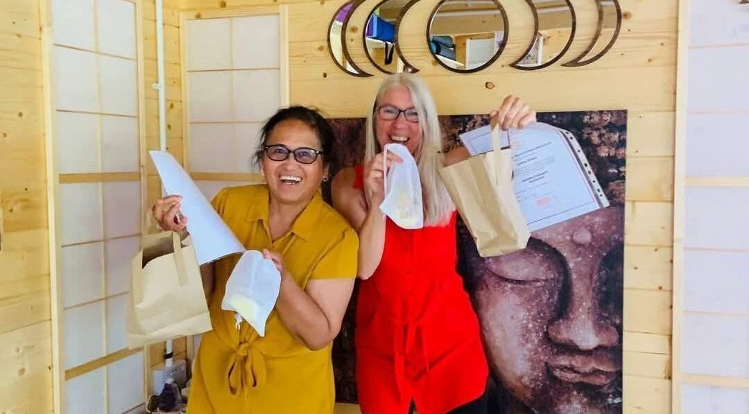 Two women celebrating with certificates at Southampton SO19 9JR venue, Southampton, England, GB.