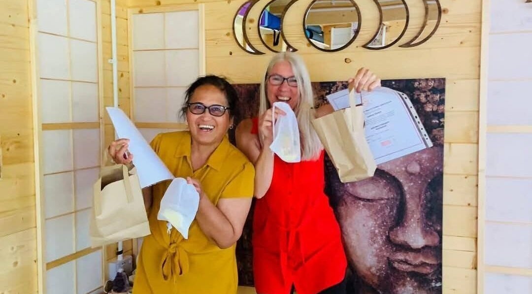 Two women celebrating with certificates at Southampton SO19 9JR venue, Southampton, England, GB.