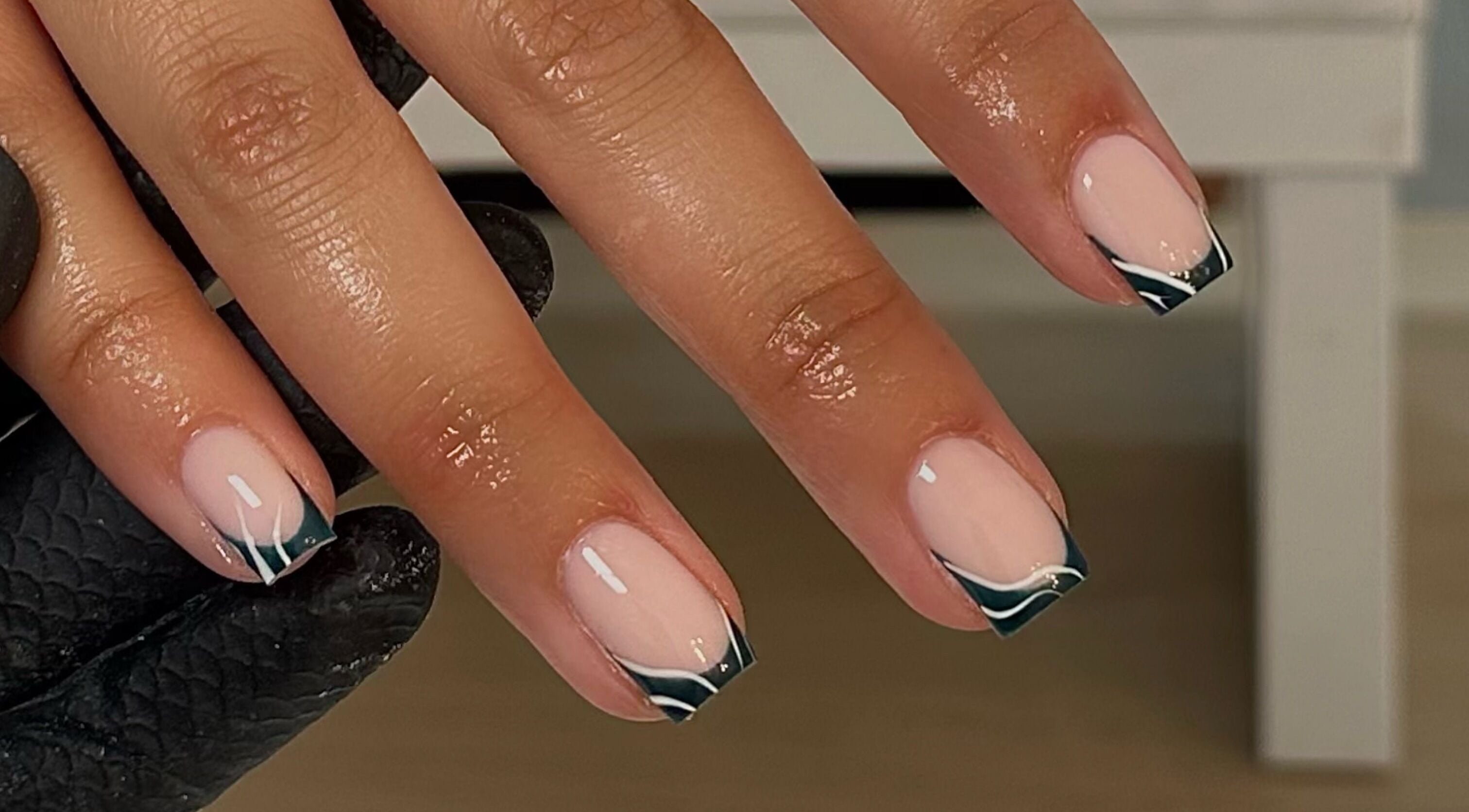 Manicured nails with black tips at A.B Studio, Cardiff, Wales, GB.
