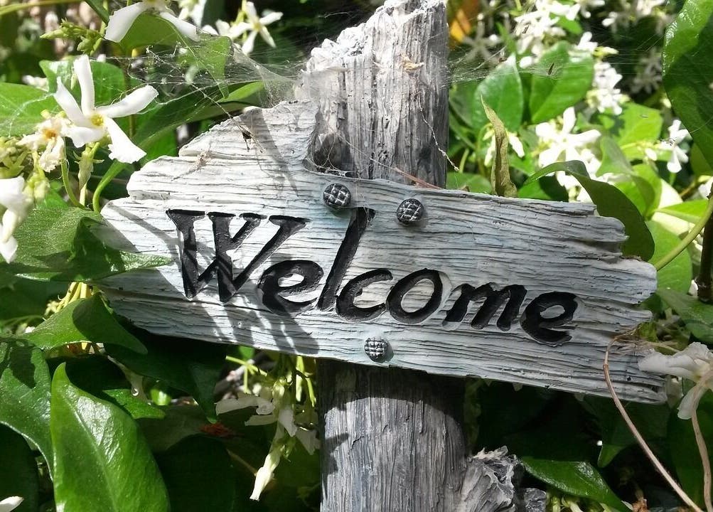 Welcome sign in garden at SOLACE Reiki, Energy & Wellness, St. Albert, Alberta, CA.