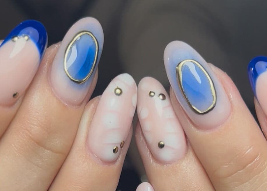 Stylish nail art with blue and gold accents by Nails by Jen, St Helens, England, GB.