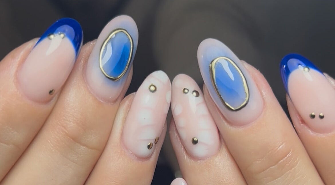Stylish nail art with blue and gold accents by Nails by Jen, St Helens, England, GB.
