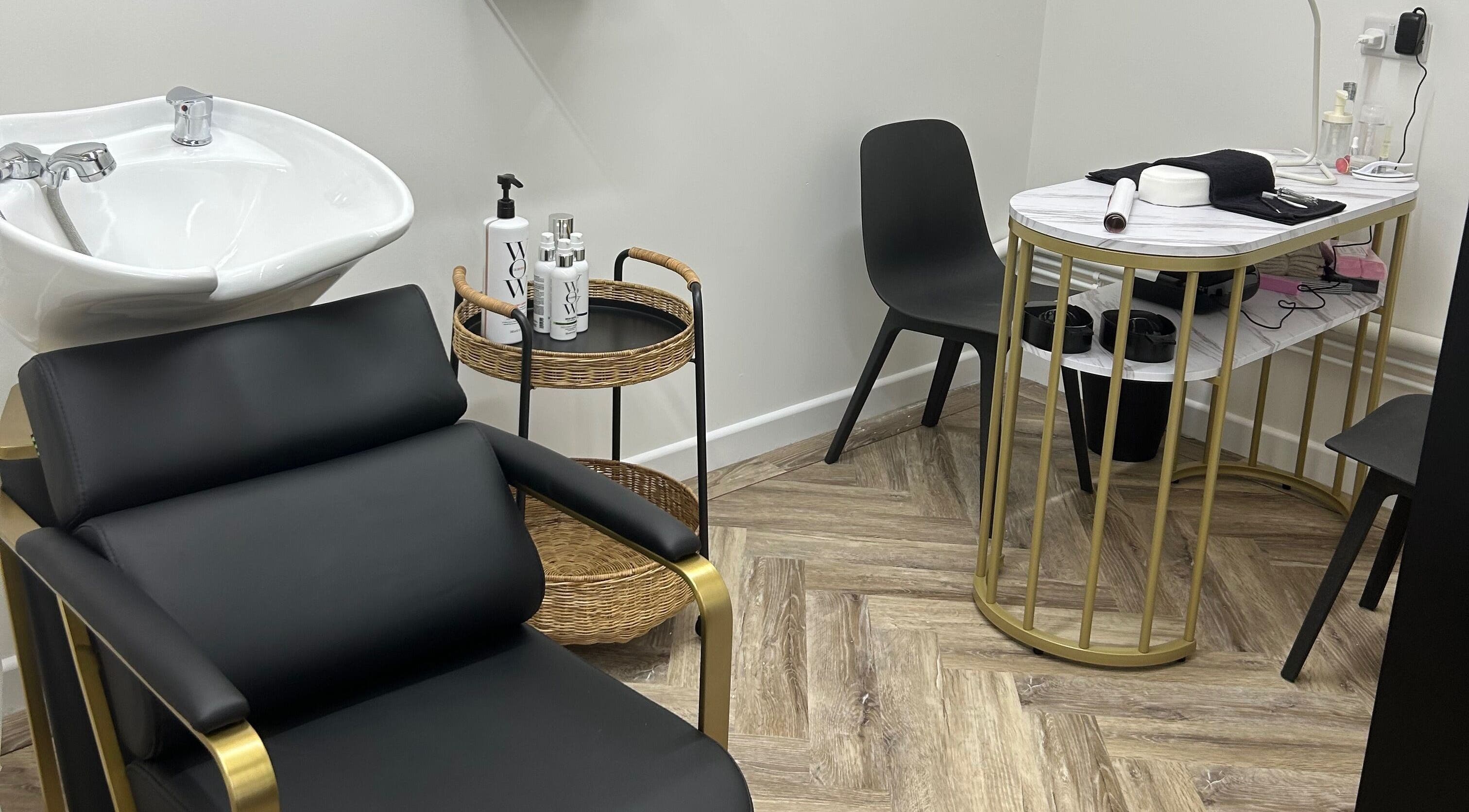 Modern salon chair and washing basin at Beauty Bae in Havant, England, GB, offering stylish hair services.
